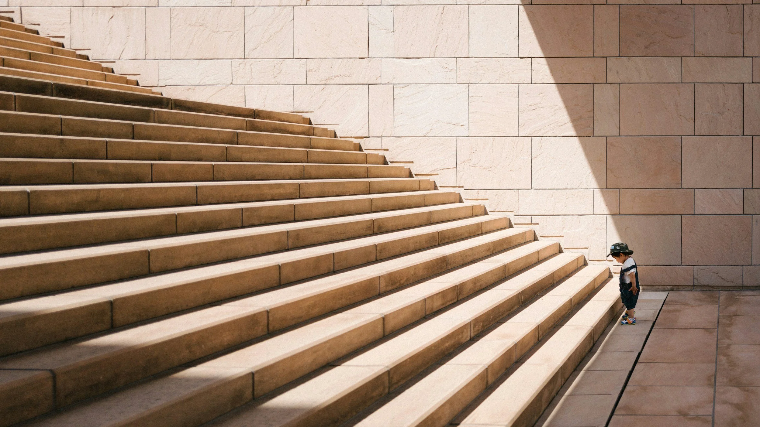 Stone steps with a young child waiting to climb